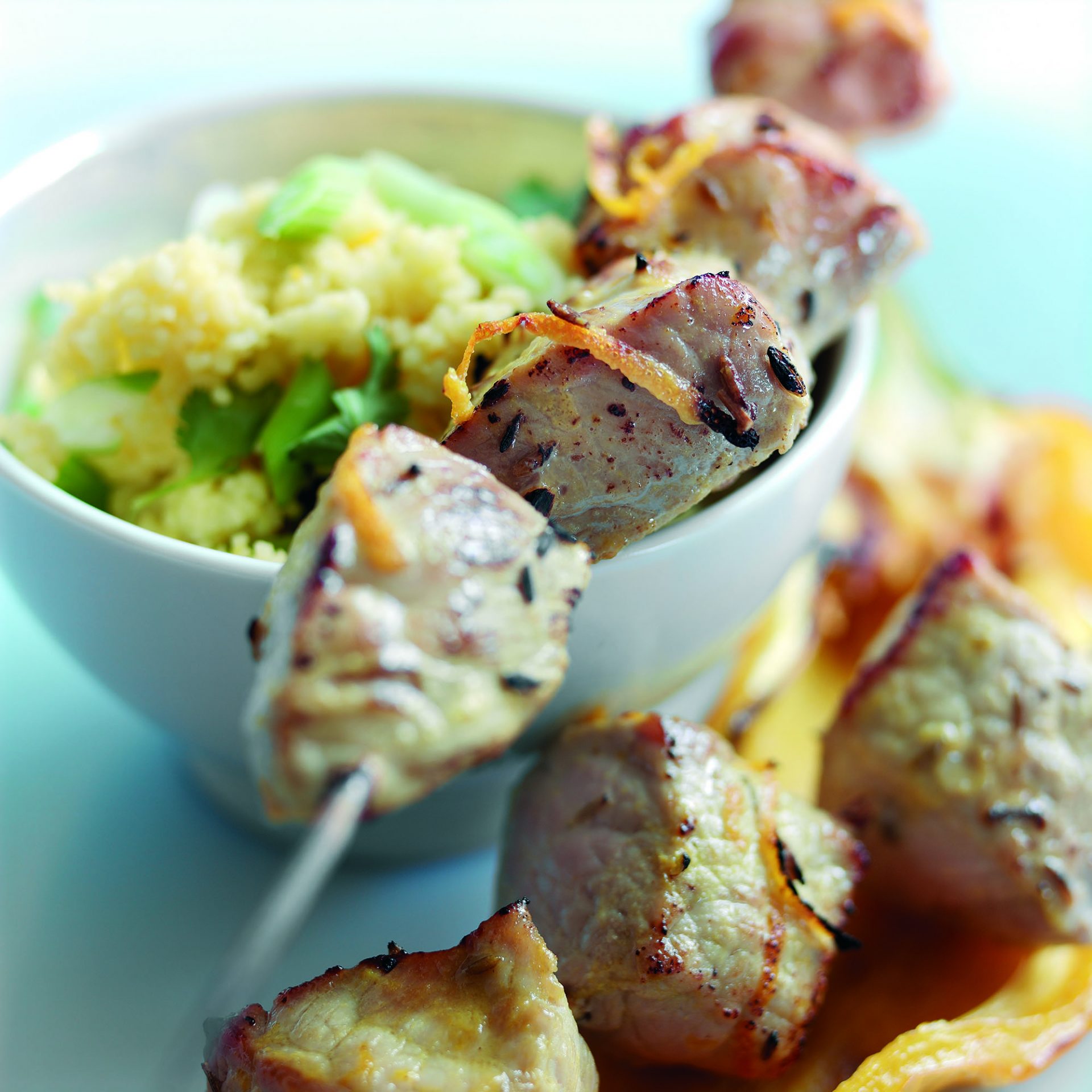 Skewered pork chunks with orange and cumin marinade