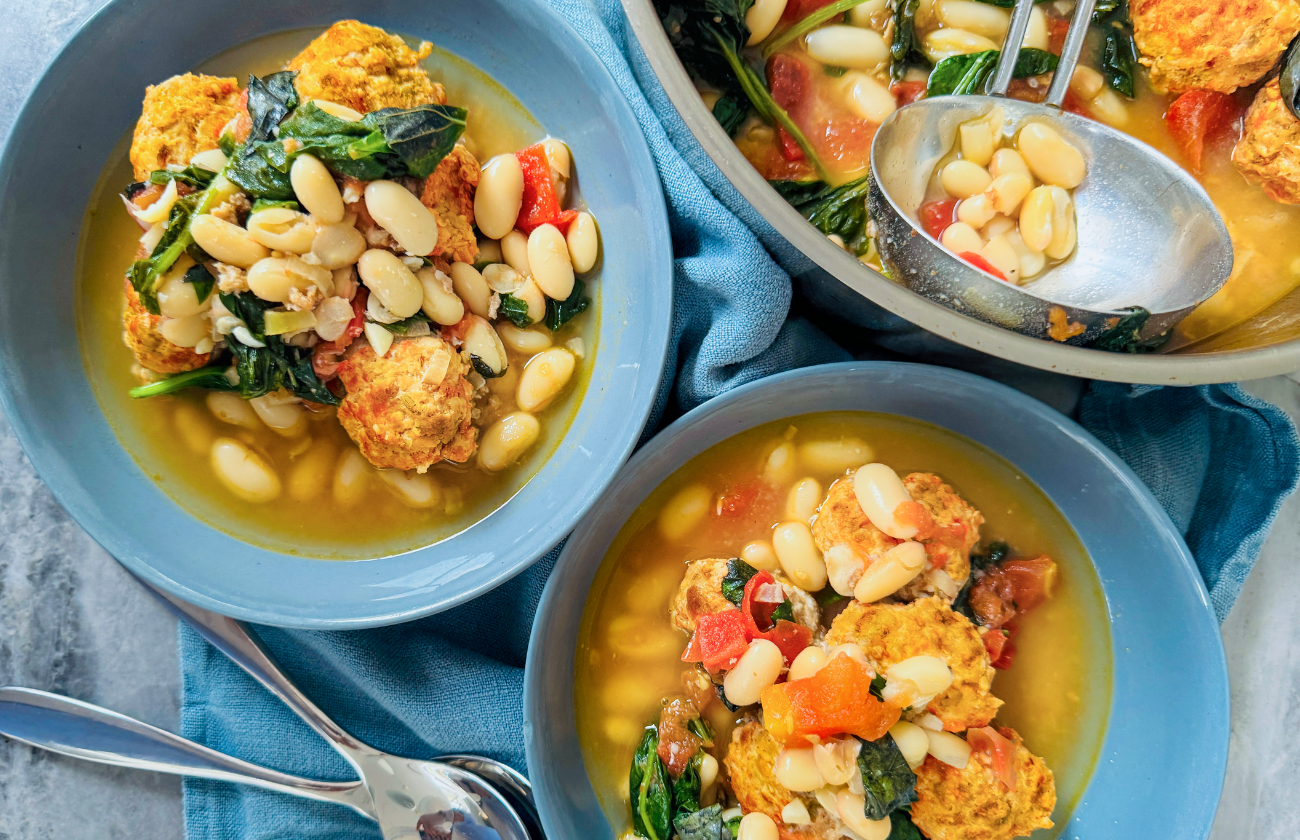 A bowl of pork meatballs with lemon and cannellini broth
