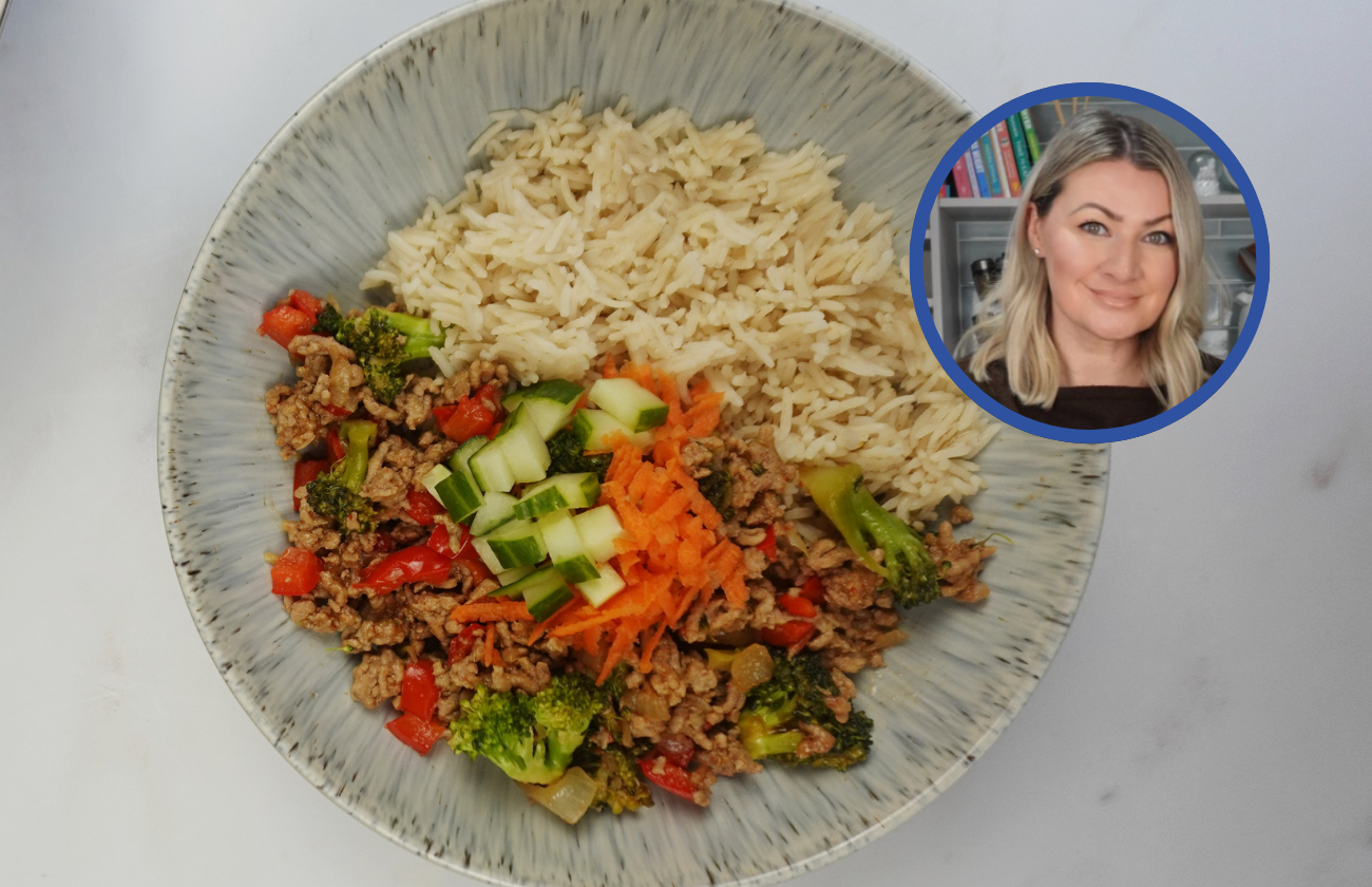A plate of Pork Hoisin Stir Fry with rice and vegetables.
