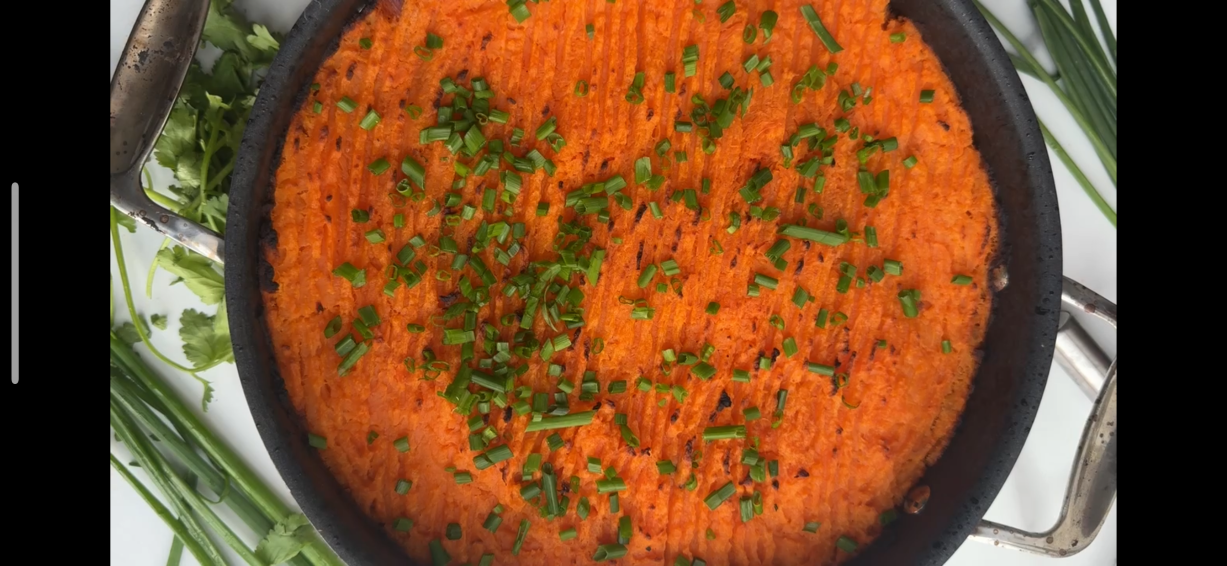 A pan of pork mince with sweet potato mash on top.